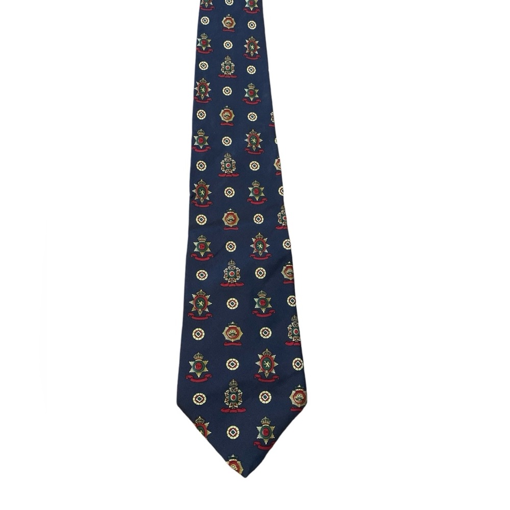 Tommy Hilfiger 100% silk tie. Navy w/ a pattern of crests. excellent condition.